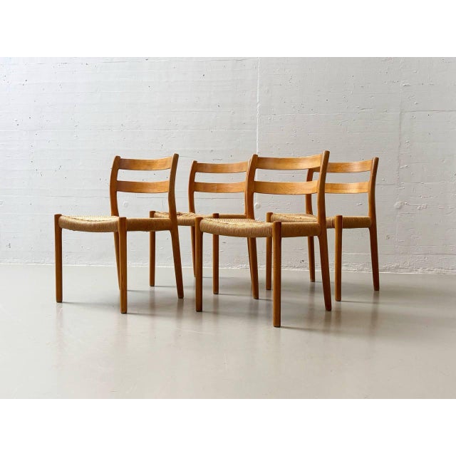 An elegant set of four chairs by danish designer niels o. Møller, produced by j.l. Møllers in the 1960s. The chairs...