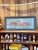 Striking antique Grand Trunk Railway metal sign featuring a detailed depiction of a steam locomotive and coal tender,...
