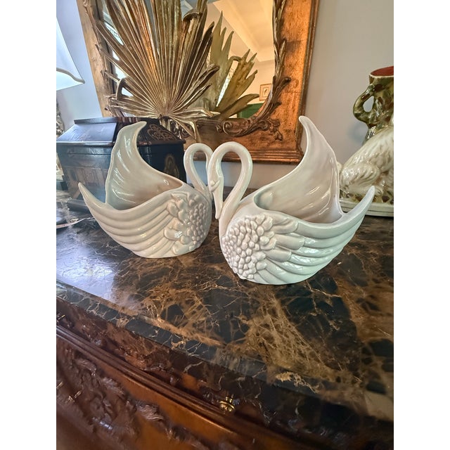 A rare set of Royal Haeger swan vases. The ceramic vases are a light gray in color. It is extremely rare to find both a...