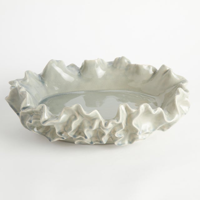 Botanically-inspired with a delicate ruffled, sea life-like edges. A durable stoneware, made with an innovative process,...