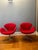 Pair of authentic red fabric Swan Chairs in excellent condition. Designed by Arne Jacobsen and produced by Fritz Hansen....