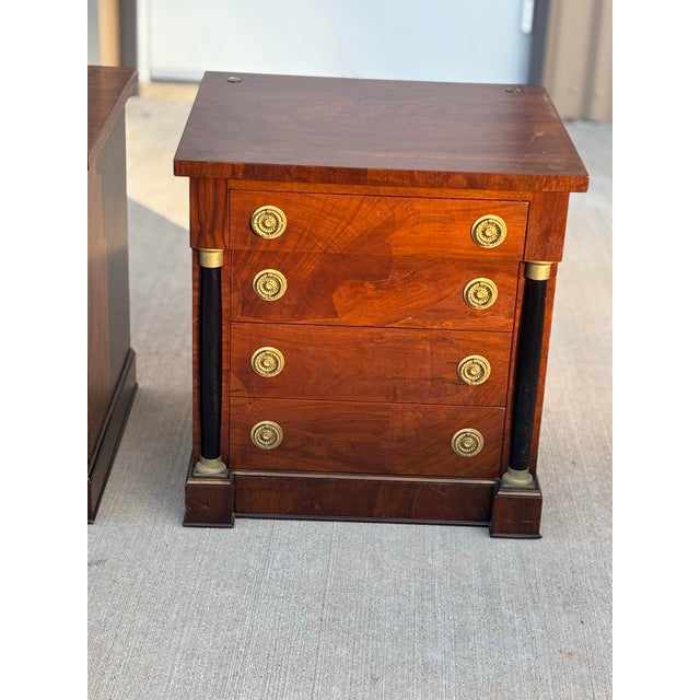Equally suited for use as nightstands or petite accent tables, this rare matching pair brings timeless sophistication,...