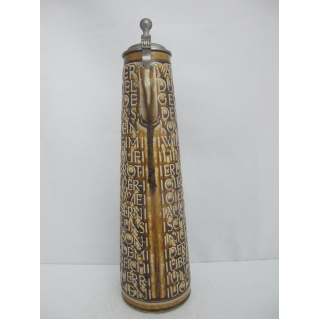 Vintage Reinhold Merkelbach German stoneware beer stein featuring the Lord's Prayer ("Vater Unser") in raised relief...