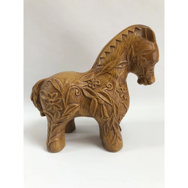 Mid-Century California Pottery ceramic horse figurine decorated in relief with flowers and leaves throughout. Maker's mark...