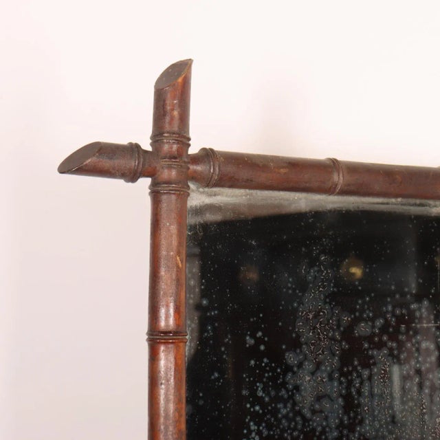 19th C French faux bamboo mirror. Lovely foxing on the original glass plate. 1890. This piece is designed in the style of...