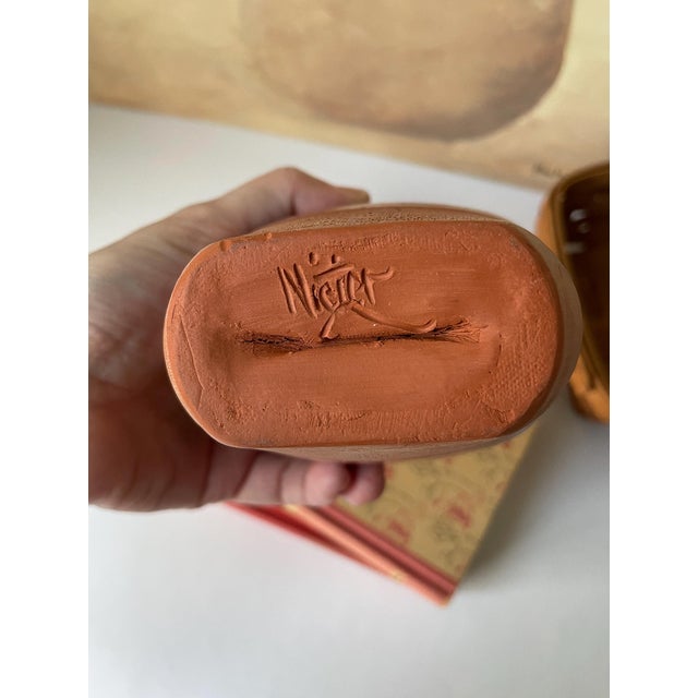 A beautifully handcrafted signed Gary Nieter terracotta vase, featuring a rustic farmhouse silhouette and warm, earthy...