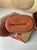 A beautifully handcrafted signed Gary Nieter terracotta vase, featuring a rustic farmhouse silhouette and warm, earthy...