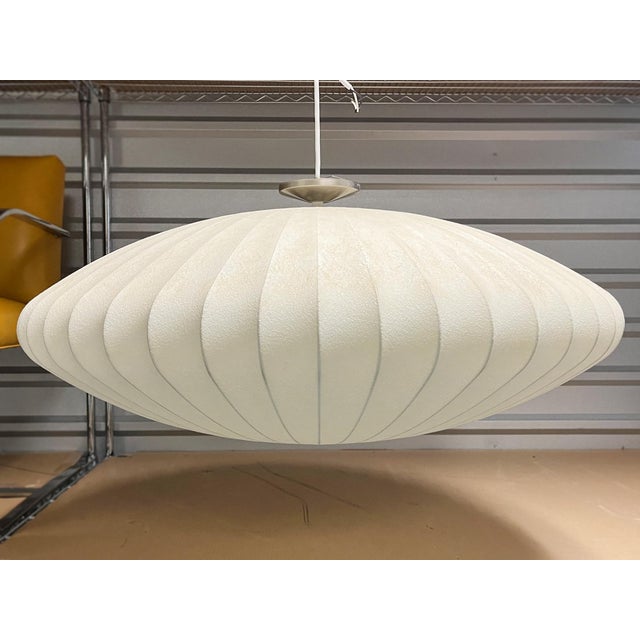 From the Nelson Bubble Pendant Lamp series, designed by George Nelson in the 1950s. This pendant is crafted in a wide...