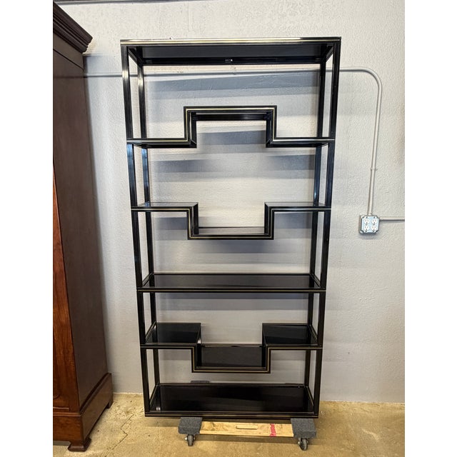 Striking 1970s Hollywood Regency etagere designed in the distinct style of celebrated French designer Pierre Vandel,...