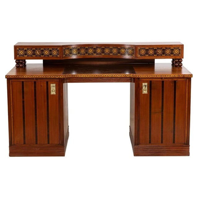 A special highlight of our gallery is this richly inlaid desk, inspired by a design by Josef Maria Olbrich. The design was...