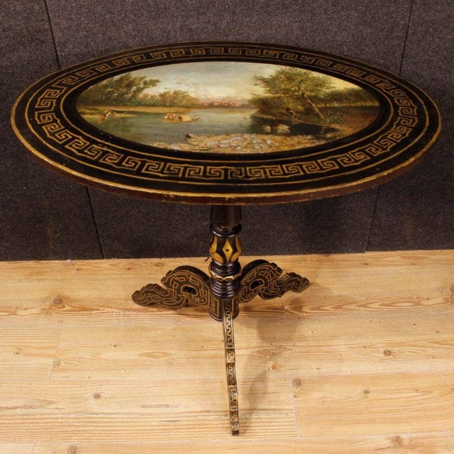 English side table from the first half of the 20th century. Nicely lacquered and painted wooden furniture with a fabulous...