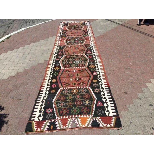 This beautiful, vintage, handwoven kilim is approximately 60 years old. It is handmade of very fine quality, hand-spun...