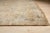 This hand knotted pile rug is crafted from wool and features a primary color palette of ivory, beige, cream, and white....