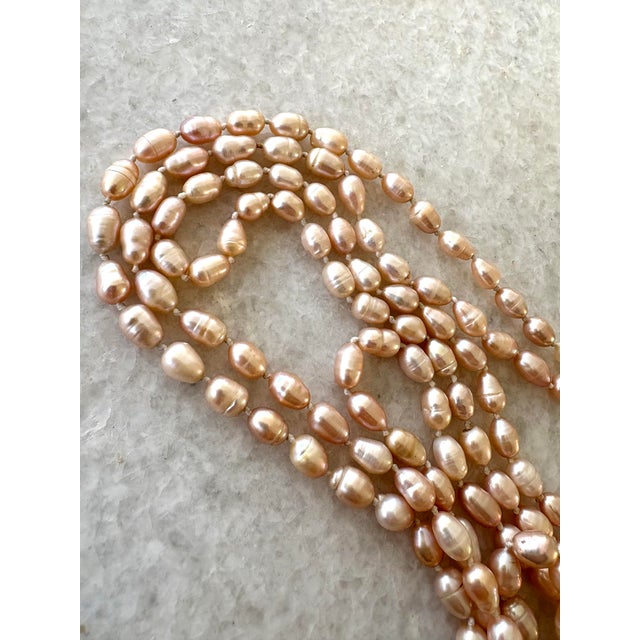 Gorgeous vintage large freshwater pearls long necklace great for wrapping. Beautiful soft pick tone. 60” long