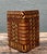 A vintage geometric inlaid wood box characterized by its striking marquetry design. The piece showcases a harmonious blend...