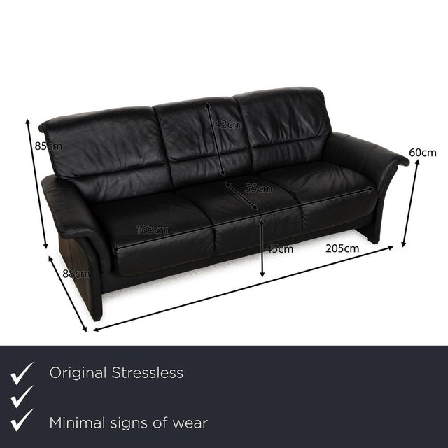 The Stressless sofa is covered in black leather and stands on floor-to-ceiling side panels. The three-seater is...