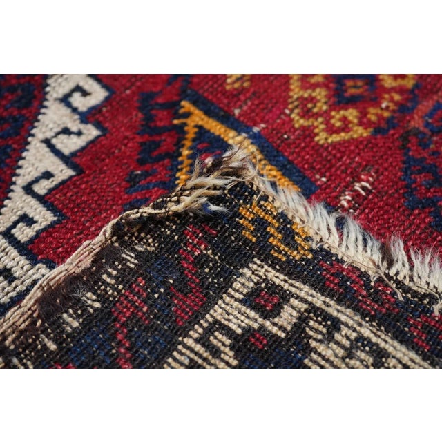 Not Persian, but from the Kurdish Yuruk tribes of eastern Anatolia. The characteristic orange-red field displays hooked...