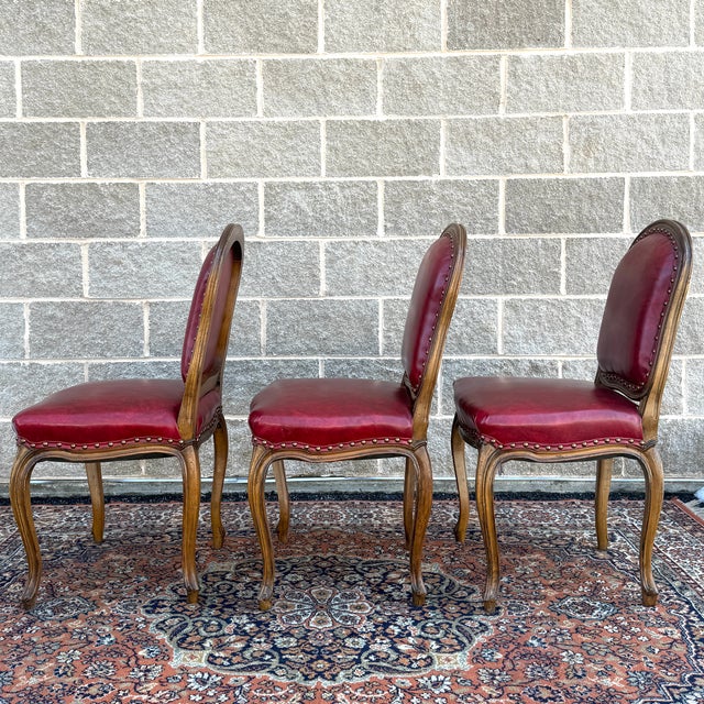 Mid 20th Century Mid 20th Century Tacked Red Vinyl & Fruitwood French Louis XV Fauteuil Dining Chairs - Set of 3 For Sale - Image 5 of 17