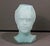 A sculptural frosted aqua-green glass head vase with a softly modeled modernist face and bust form. The matte glass...