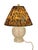 Add a bold touch of vintage glamour to your space with this charming glass table lamp paired with a striking tiger print...