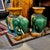 This is a classic pair of Sancai stoneware garden seats in the form of green glazed elephants with raised and curled...