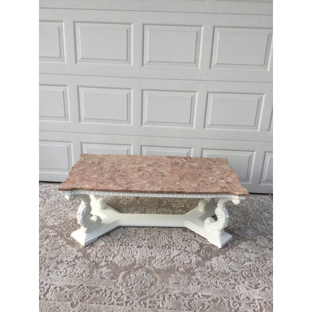 Rectangular carved wooden coffee table, painted white to give it a refreshed look, as it is quite old. Easy to style in...