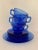 The cobalt blue hue of Art Deco “Moderntone” by Hazel Aflas is head turning in color and draws the attention immediately....