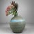 A remarkable Japanese ikebana vase crafted by ceramic artist Katori Hoichi (香取甫市). This piece bridges the timeless...