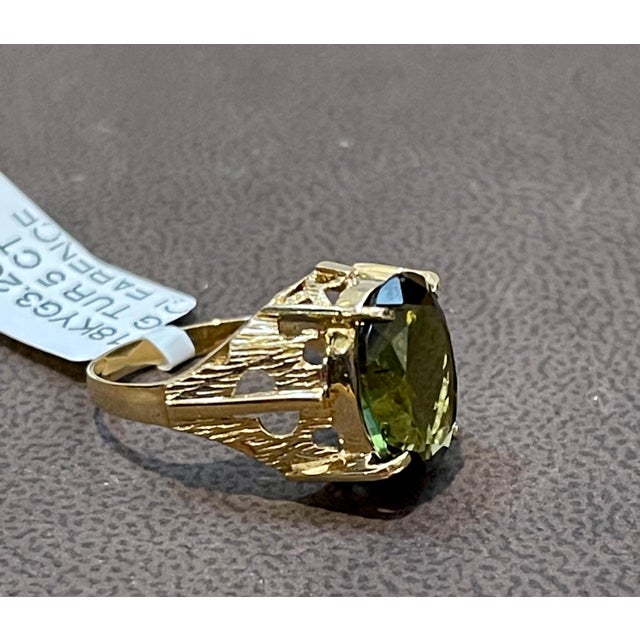 5 Carat Natural Oval Green Tourmaline Cocktail Ring 18 Karat Yellow Gold A classic, Cocktail ring Measurements of the...