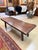 A distinguished vintage coffee table showcasing the natural beauty and character of solid wood. Featuring a substantial...