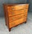 This 19th century four drawer chest showcases striking burled walnut drawer fronts framed by solid cherry, creating a rich...