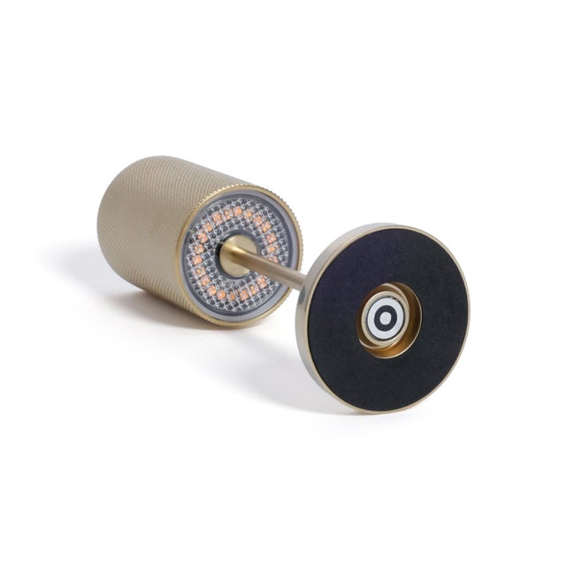 Illuminate your space with the refined elegance of the Gold Rechargeable Table Light. Designed for modern living, this...