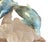 A finely carved aquamarine and rock crystal sculpture of two dolphins by renowned German lapidary artist Manfred Wild,...