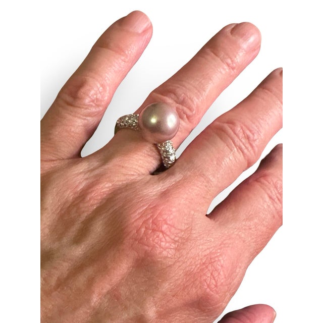 Unique sterling silver ring with a large pink mauve color natural Pearl. Made with a comfortable band, this ring is also...