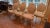 This elegant set of seven Louis XVI-style dining chairs features seven armchairs and one side chair, each showcasing...