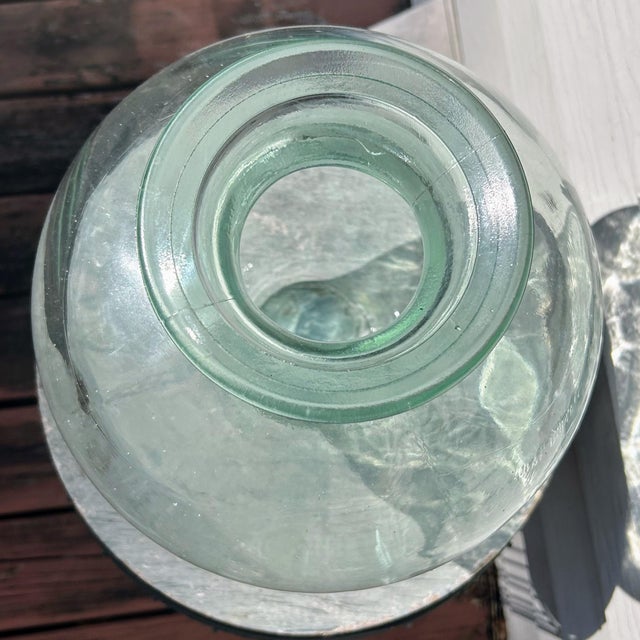 Vintage European Demijohn Bottle Green 13.5”. Beautiful demijohn bottle with green hue to glass. Measures 13.5” H x 11” W...