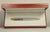 Santos Brushed Steel and 18 Karat Gold-Plated Stylo Bille Must II Ballpoint Pen with Red Box from Cartier, 2000s, Set of 3 For Sale - Image 11 of 15