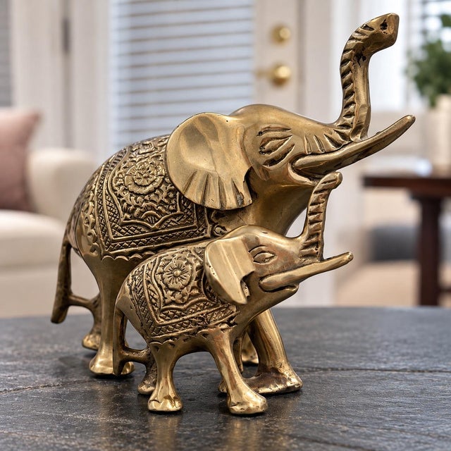 Beautiful vintage solid brass elephant and baby figurine set, made in India. Features intricate floral and geometric...