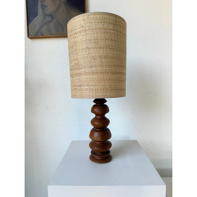 Old table lamp or desk lamp in solid oak, in turned wood with its elegant rounded shapes, from the 1950s. We love the...