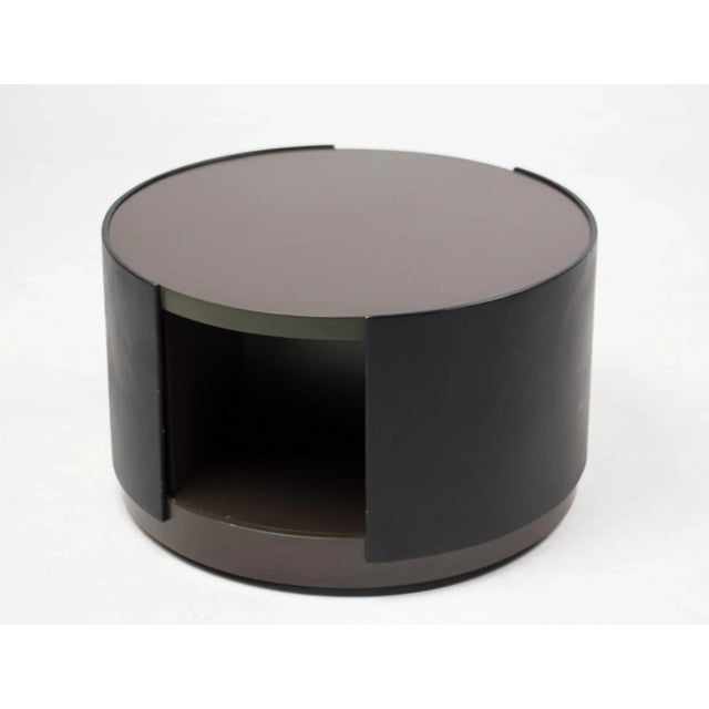 This exquisite round cabinet on non-visible wheels designed by Osvaldo Borsani for Tecno is made out of lacquered plywood,...