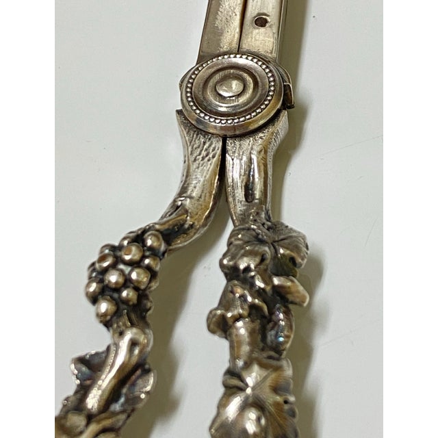 A RARE and absolutely exquisite pair of antique silver grape shears made by Gorham hallmarked on the inside of the shears...