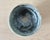 A small American studio pottery bowl made in New York, with a softly rounded hand-thrown form and a beautifully variegated...