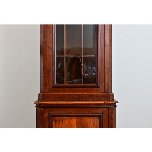 A rather unusual case piece from 19th century France, this tall and narrow Louis Philippe bibliothèque was specially...