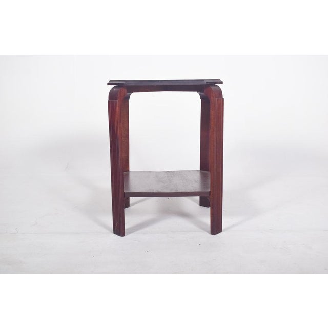 Deco style coffee table. With an octagonal-shaped top, it is made up of four vertical legs with a rectangular section,...