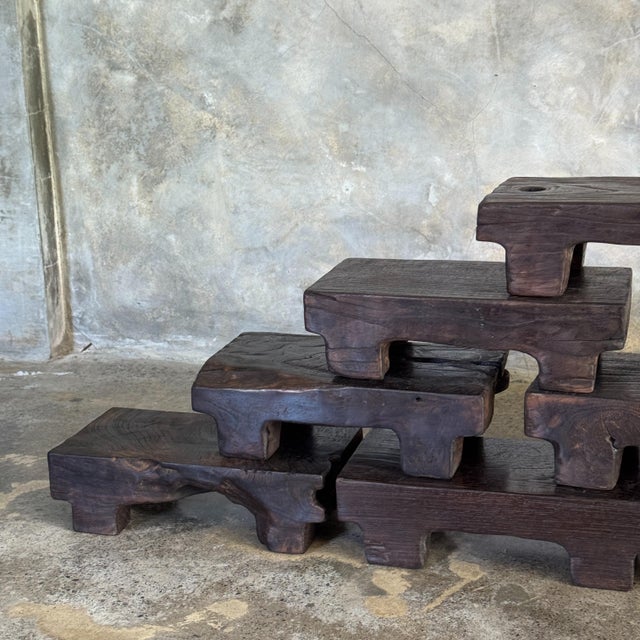 Small stool, a side stool made of solid black wabi-sabi teak. Dimensions: Height: 6 cm; Width: 30 cm; Depth: 8.5 cm. The...