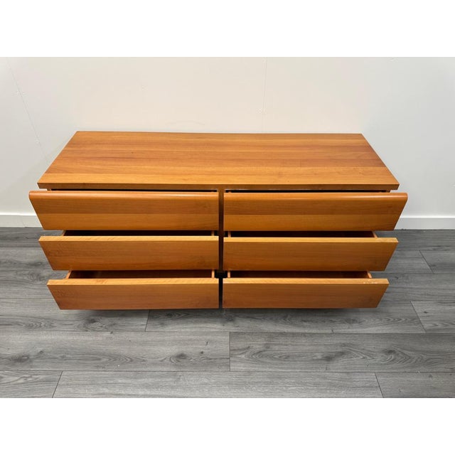 An elegant Titina Ammanati & Gianpiero Vitelli architectural design cherrywood commode comprising of six large streamlined...