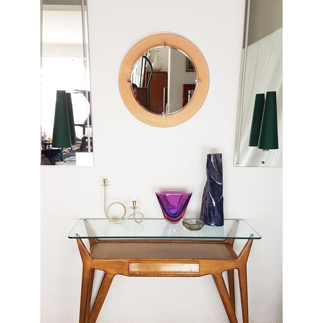 This pair of huge wall lights was produced in Italy, circa 1950s. A solid wooden frame supports the shaped mirrored glass...