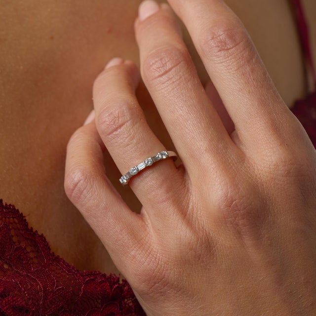 This Tiffany & Co. diamond half eternity wedding band is a beautifully refined vintage piece from the 1990’s, crafted in...
