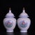 A beautiful pair of Chinese white glazed porcelain covered jars. The body features a subtle, intricately incised (anhua)...