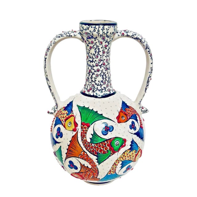 This exquisite Turkish Iznik style bottle vase is a unique piece of artwork crafted by renowned artist Mert El Sanatlari....